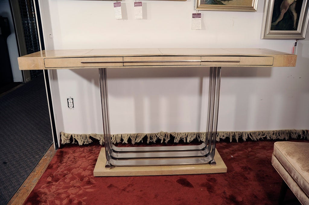 Art Deco console table with parchment covered top and base, and a 