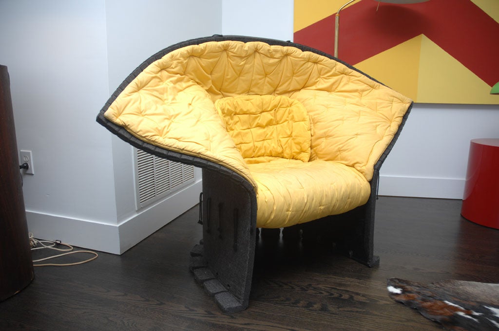 This armchair was designed by Gaetano Pesce in 1987 for Cassina.   Made entirely of thick wool felt impregnated with thermosetting resin and fixed to the frame by means of hempen strings.  Imaginative and whimsical it was Pesce's way of