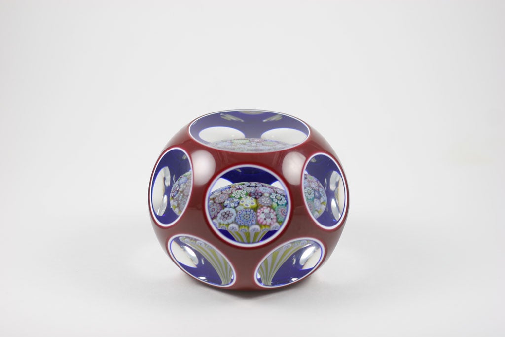 An exceptional Peter McDougall triple overlay paperweight with a close-packed millefiori mushroom in a yellow and white stave basket