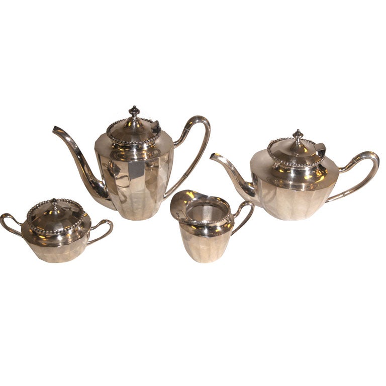 A STERLING SILVER TEA AND COFFEE SERVICE. MEXICAN, CIRCA 1950