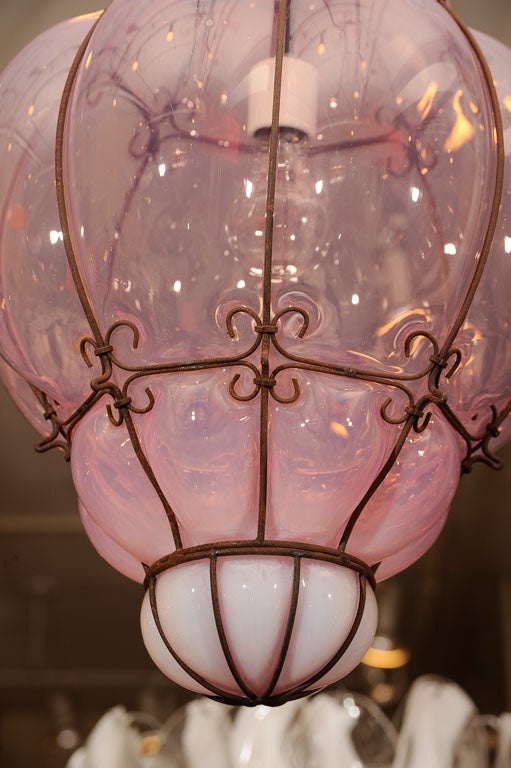 Lovely hand blown murano glass lantern or pendant with weathered wire cage. Located at Las Venus @ ABC Home 646-602-3519.