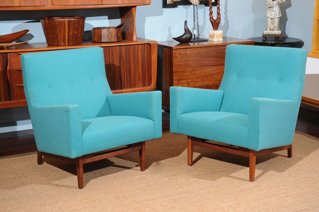 Pair of Jens Risom design armchairs on walnut bases and turquoise tweed.