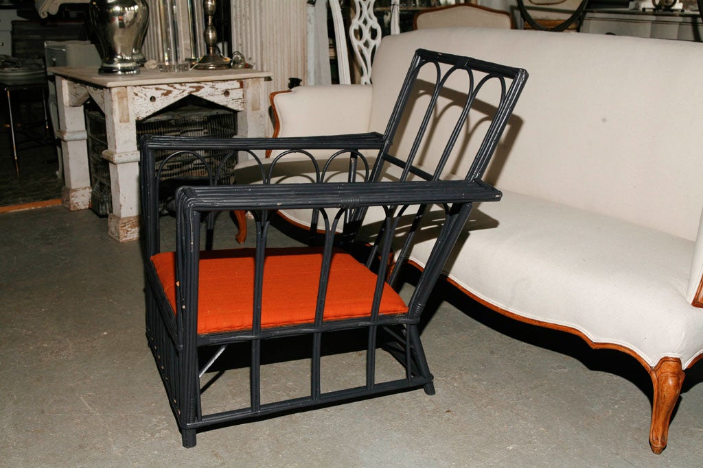 Stylish stick wicker chair painted black.<br />
<br />
keywords:  rattan, wicker, split reed chair