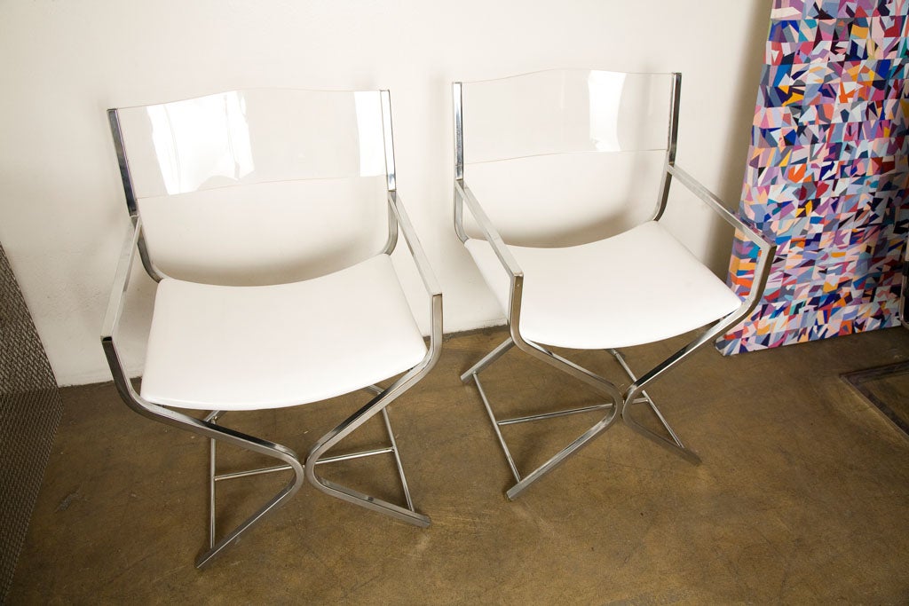 Late 20th Century Pair of Lucite and chrome directors chairs.