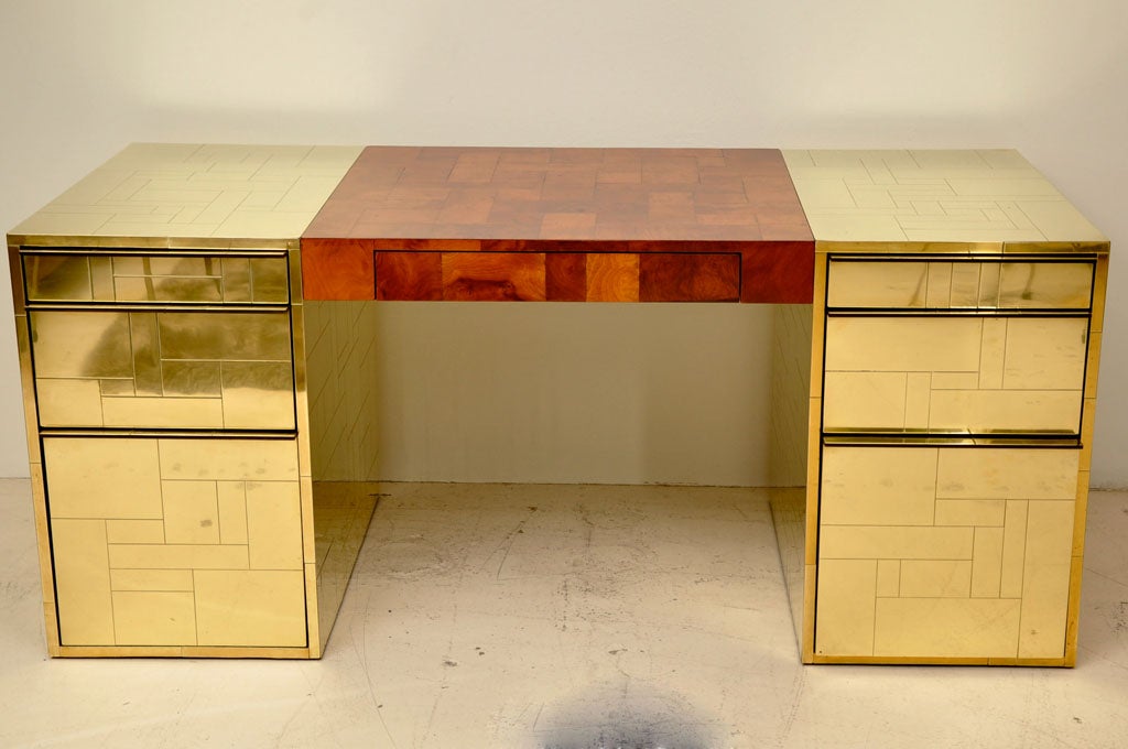 Executive size Paul Evans Desk made with Olive Burl and Brass Laminate for Directional.  Three drawers on either pedestal and one in the center, with the large bottom drawers being file drawer size.