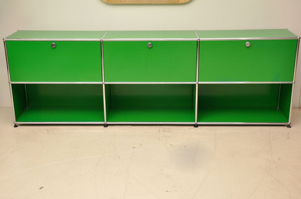 Low profile kelly green bookshelf/credenza with compartments for storage by Haller.<br />
Modular. Can be re-configured in a variety of ways. Additional bookshelves available. Could be combined to make storage wall. Original paint.
