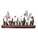 Box of metal sculptured flowers in the style of Curtis Jere