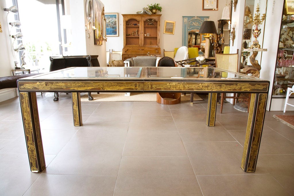 Bernhard Rohne acid-etched panels cover almost every surface of this black enamel table by Mastercraft. Thick bevel-edged glass table top.