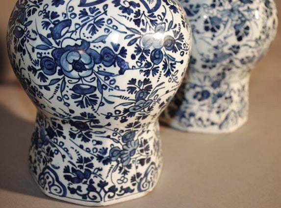 18th century Delft vases decorated in blue tones Chinese motifs.