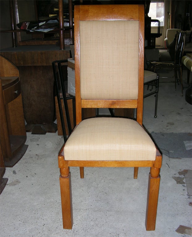 Six 1940s chairs in varnished oak and re-upholstered in fabric made of woven straw.