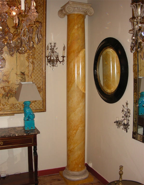 Two end of 19th century Corinthian columns, in stucco with faux marble patina.