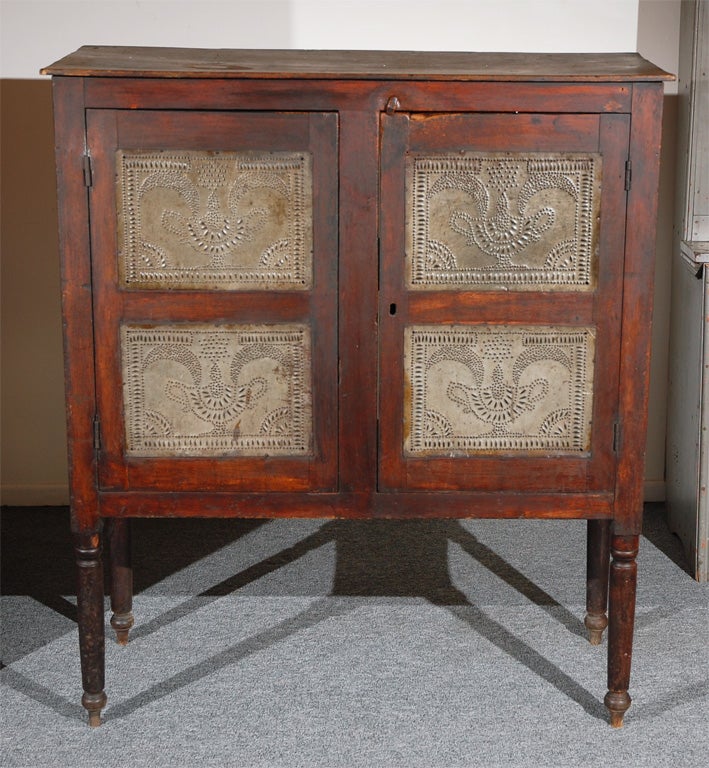 RARE & EARLY 19THC WALNUT HAND MADE PIE SAFE W/MOON AND STAR SET ABOVE A URN TINS.ALL ORIGINAL TINS AND PRISTINE CONDITION.THIS PIE CUPBOARD IS QUITE UNUSUAL AND RARE TO FIND IN WALNUT WOOD.THE TURNED LEGS ALSO TELLS YOU IT IS SOUTHERN.THE PIE
