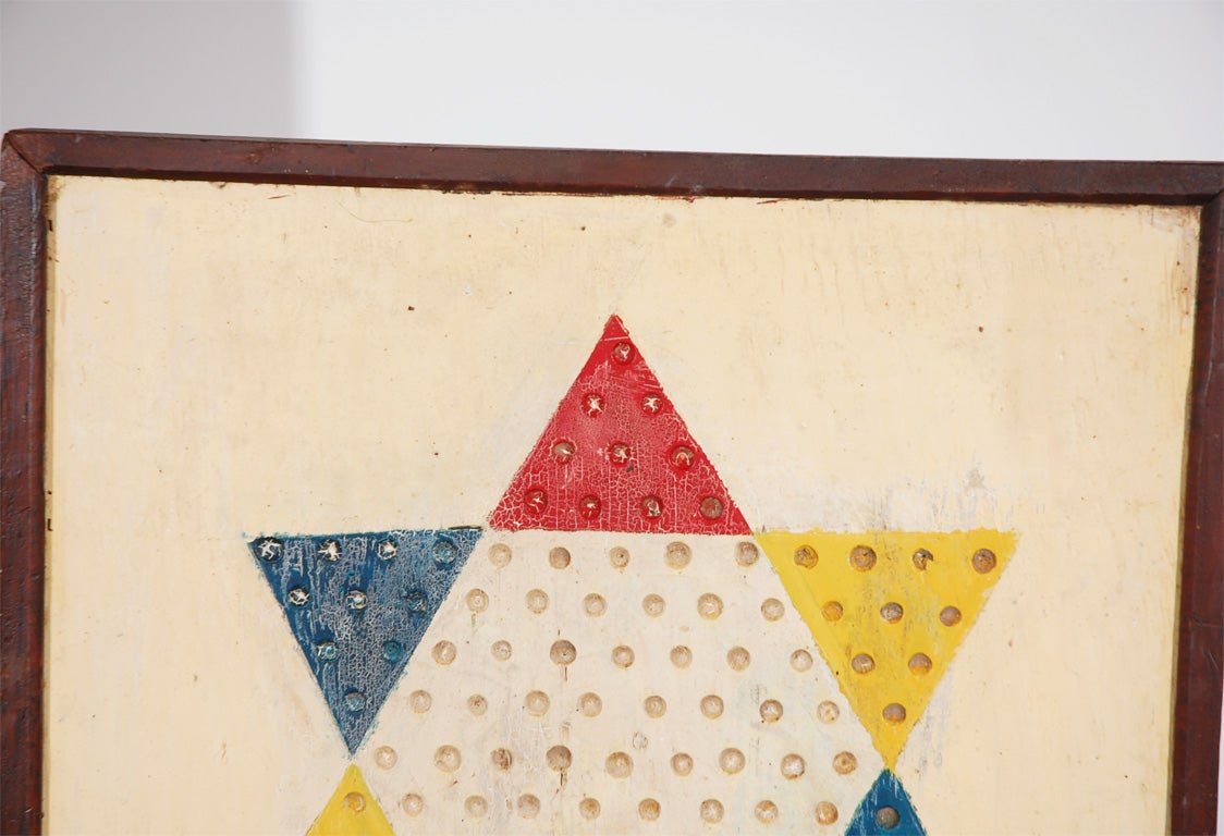 LATE 19THC DOUBLE SIDED GAME BOARD W/ORIGINAL PAINTED STAR ON FACE AND REVERSE ALL HAND MADE INLAID WOOD BACK.THE FACE IS A MARBLE GAME W/WONDERFUL ALIGATORED PAINT SURFACE.THE REVERSE IS A HAND MADE/INLAID WOODS,CHECKER BOARD.THIS IS QUITE UNUSUAL