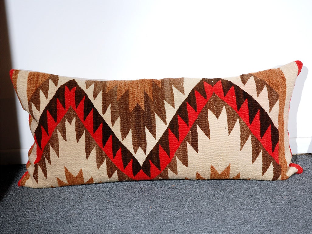 EARLY 20THC AUTHENTIC NAVAJO INDIAN WEAVING BOLSTER PILLOWS IN WOOL W/LINEN BACKS.WONDERFUL COLORS AND CONDITION.DOWN AND FEATHER FILLED.SOLD INDIVIDUALY 795. EACH