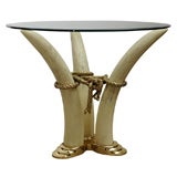 Faux Tusk 
Brass glass top table