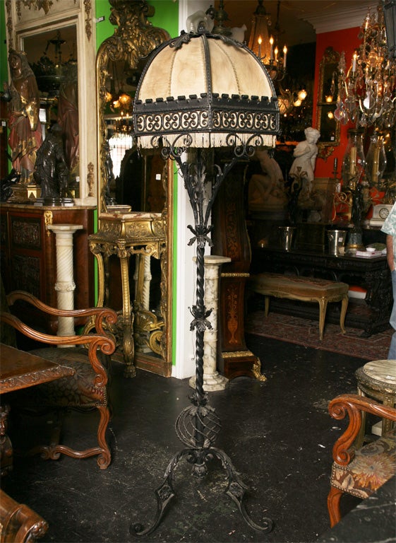 Wrought iron floor lamp with a dome shade. M906.