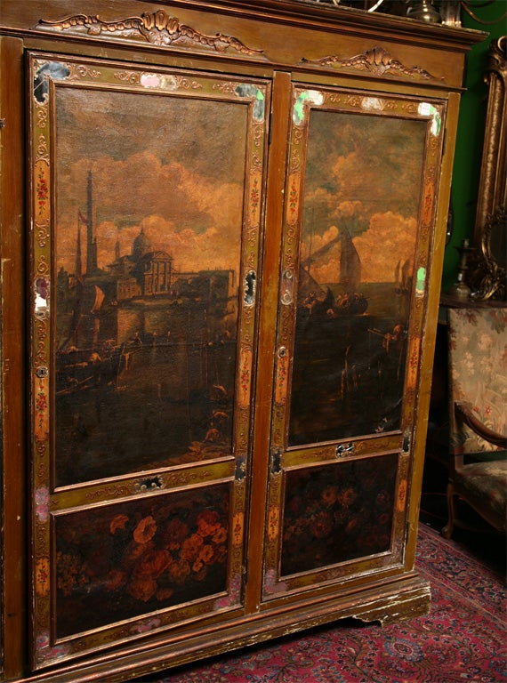 19th century Venetian painted three-door cabinet having a molded cornice over three doors with 18th century painted canvas panels, opening to reveal an interior fitted for shelves.

After 43 years of business we are retiring. Everything must be