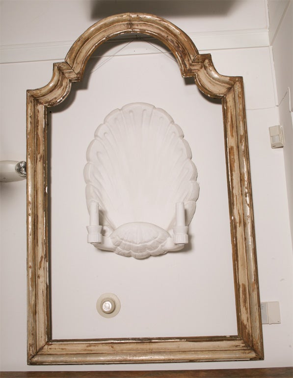 Carved wood,gesso,paint and traces of silver,new mirror