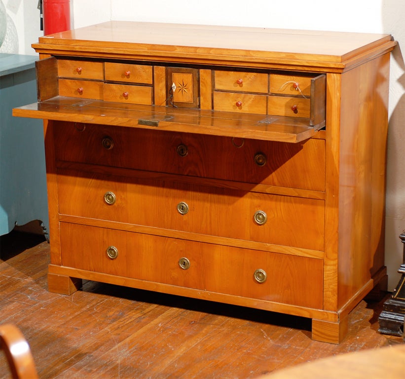 A Swedish period Karl Johan butler's desk or chest with pull-out desk over three drawers. The desk consists of eight drawers, a small center cabinet with an inlay star flanked by two hidden vertical compartments.

The Karl Johan period follows the