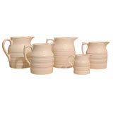 Collection of Six White Pottery Milk Jugs, England, c. 1900