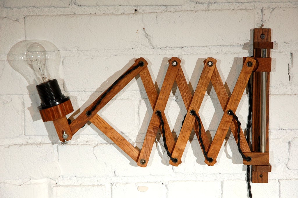 Wooden accordion Dutch sconce, newly rewired. Expands out over 30