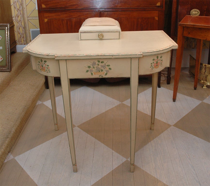 American 19th Century Federal Dressing Table <br />
circa 1800, having the original white paint with three stenciled baskets of flowers<br />
across the front