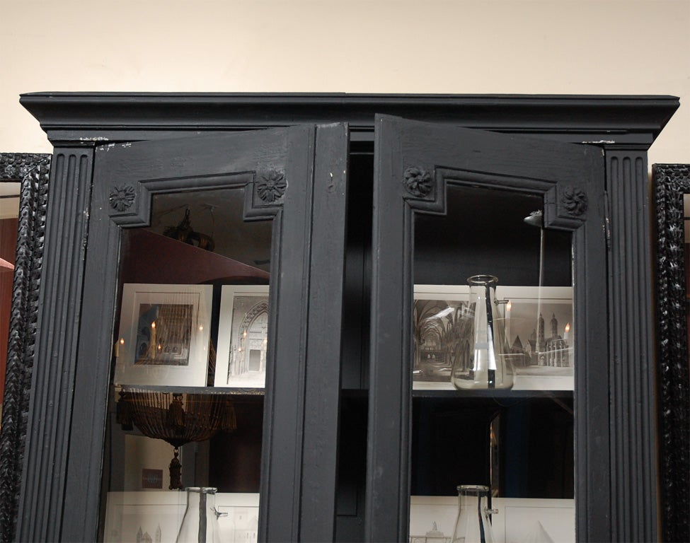 Late 18th Century French Library Cabinet with partial glass doors in matt black patina.