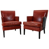 A PAIR OF LEATHER ARMCHAIRS