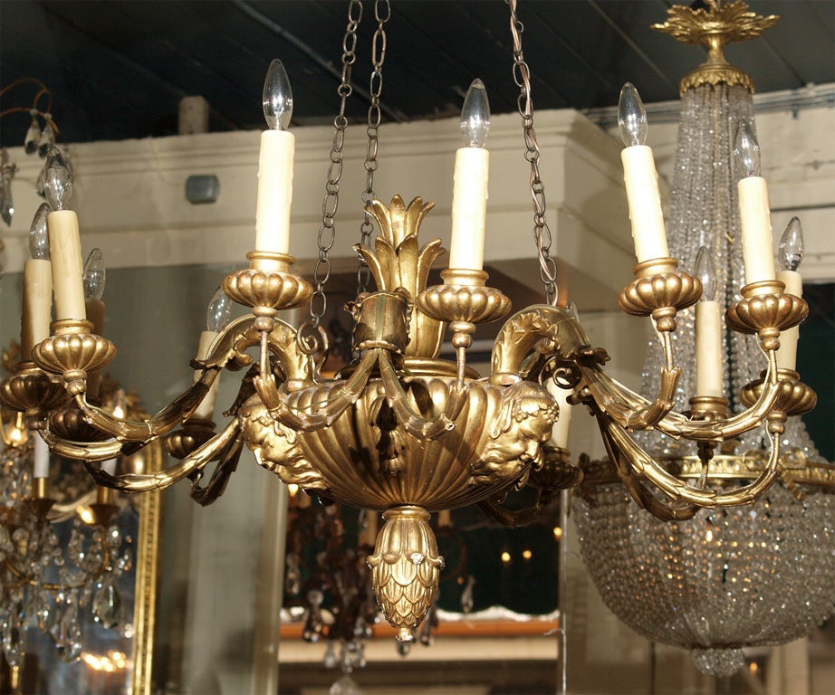 Antique Italian carved giltwood twelve light chandelier. In Good Condition In New Orleans, LA