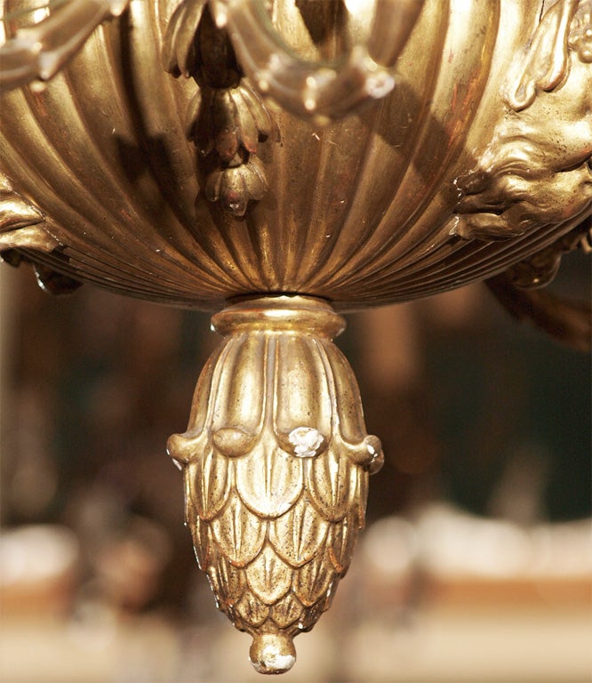 19th Century Antique Italian carved giltwood twelve light chandelier.