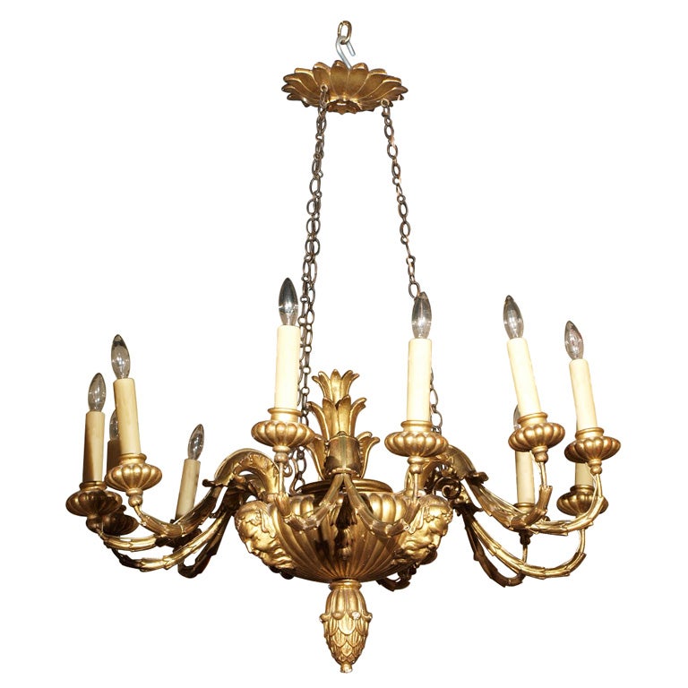 Antique Italian carved giltwood twelve light chandelier.