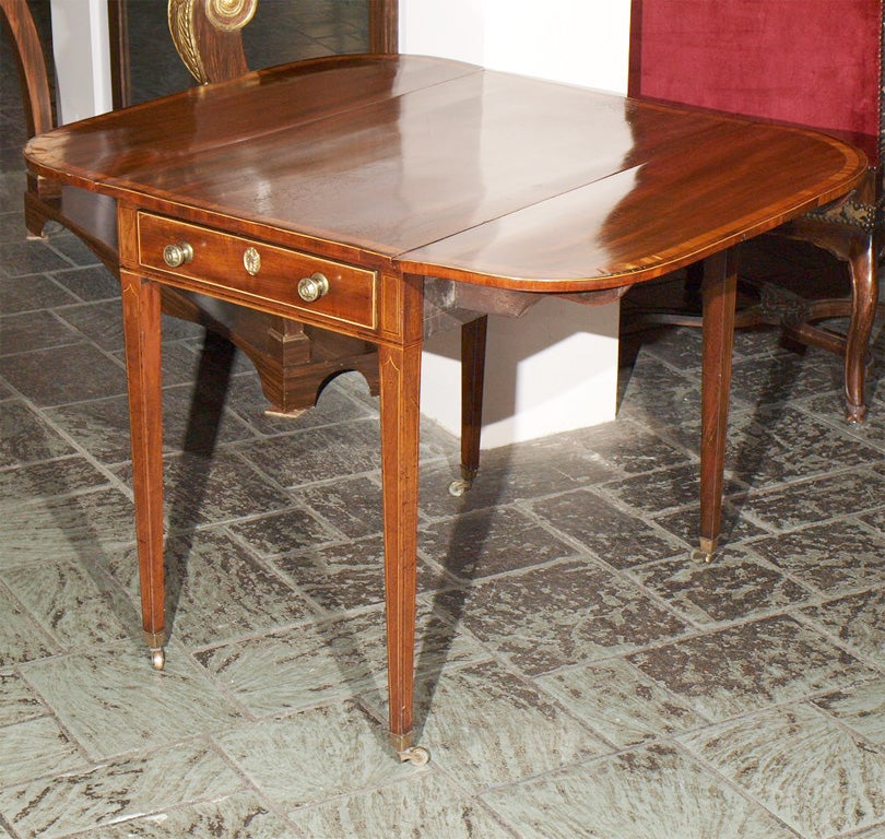 Antique English mahogany banded Pembroke table.