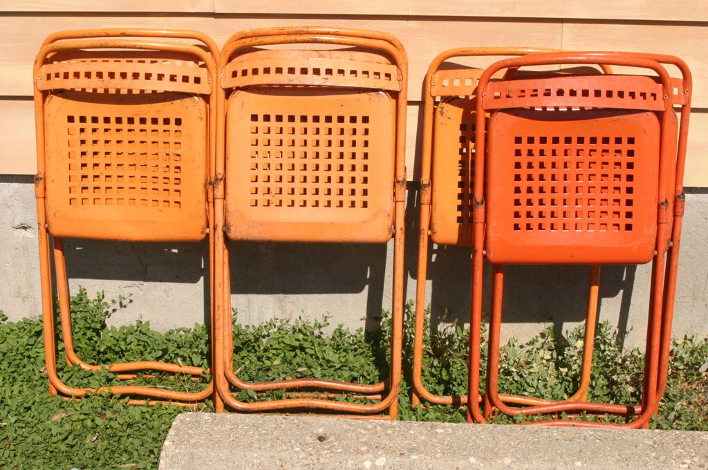6 brightly colored French metal folding chair, 2 red, 2 white and 2 orange reamaining.<br />
<br />
<br />
Keywords:  Garden chairs,  kitchen chairs, bistro chairs
