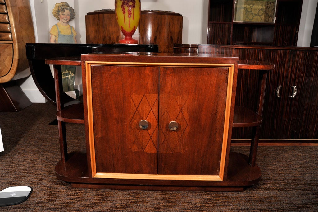 French Art Deco mahogany bar with marquetry, interior shelves and a mirrored back.