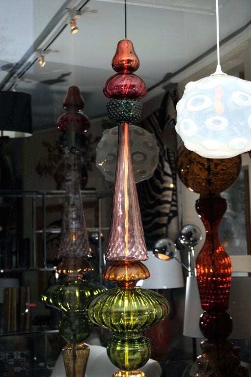 Very decorative, tall glass sculptures by Corbett Reynolds, an American artist.<br />
These are sold.