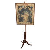 Antique English walnut pole screen.