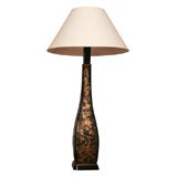Tall gold and black splash tole lamp