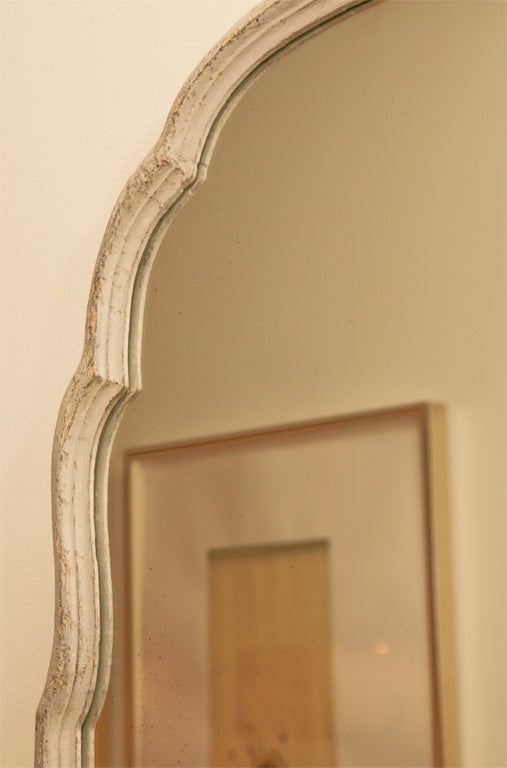Painted wooden mirror frame with Moorish-style arched top.  New mirror glass.