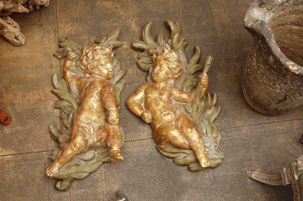 PAIR OF GILTWOOD AND CHALK PUTTIES