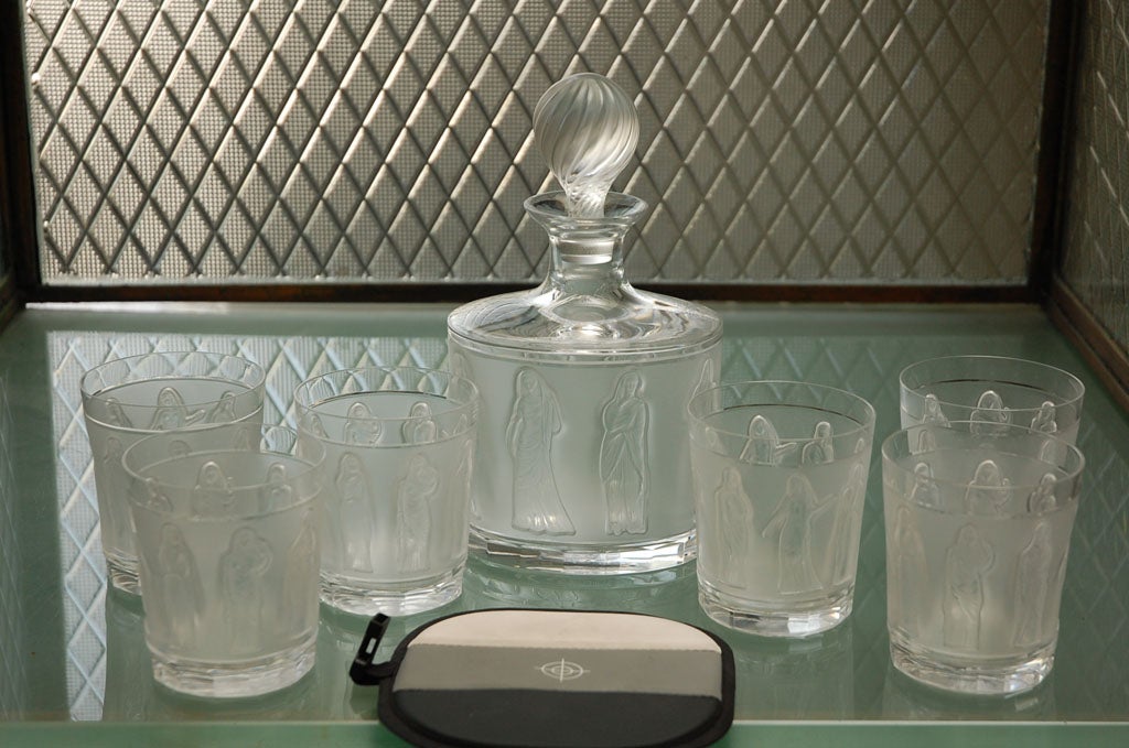 Lalique Femmes Decanter and 6 Glasses.  Glasses are circa 1970.<br />
Glasses measure 4