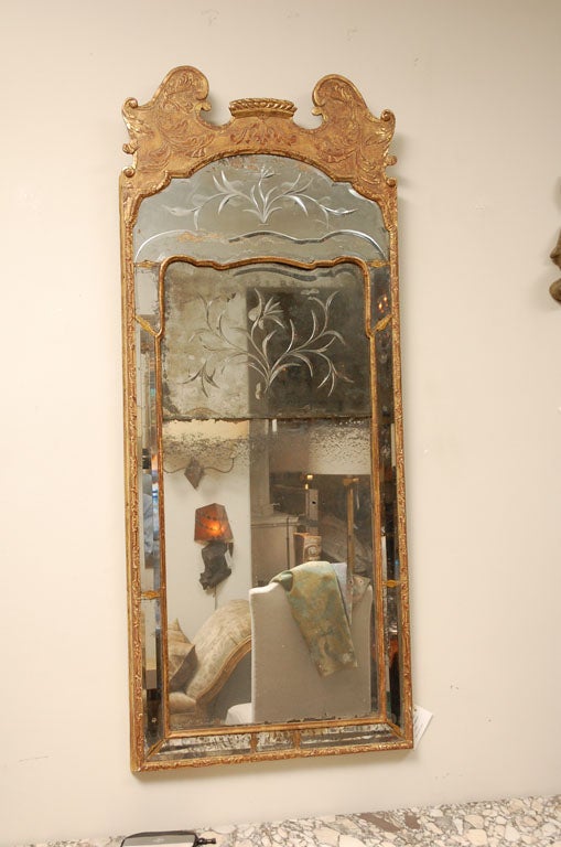 Hand carved and gilded Swedish mirror with original mirror.