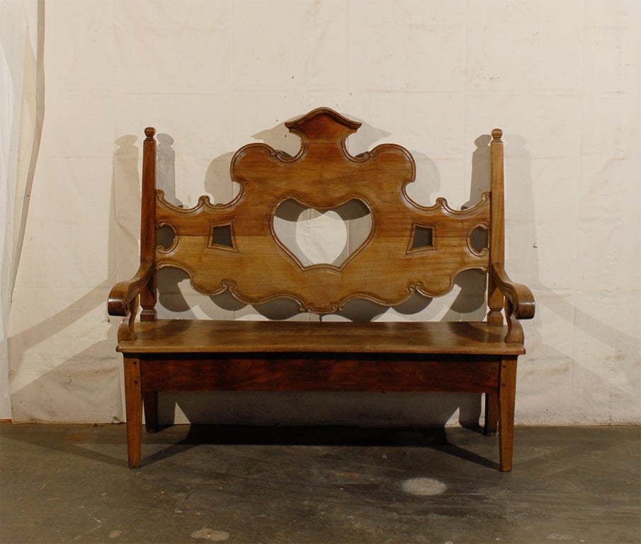 A Brazilian Hand-Carved Wooden Brazilian Bench with unique Back and scrolled arms from the 20th Century.