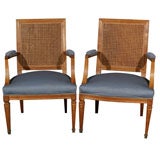 Pair of Cane Back Stamped Jansen arm chairs