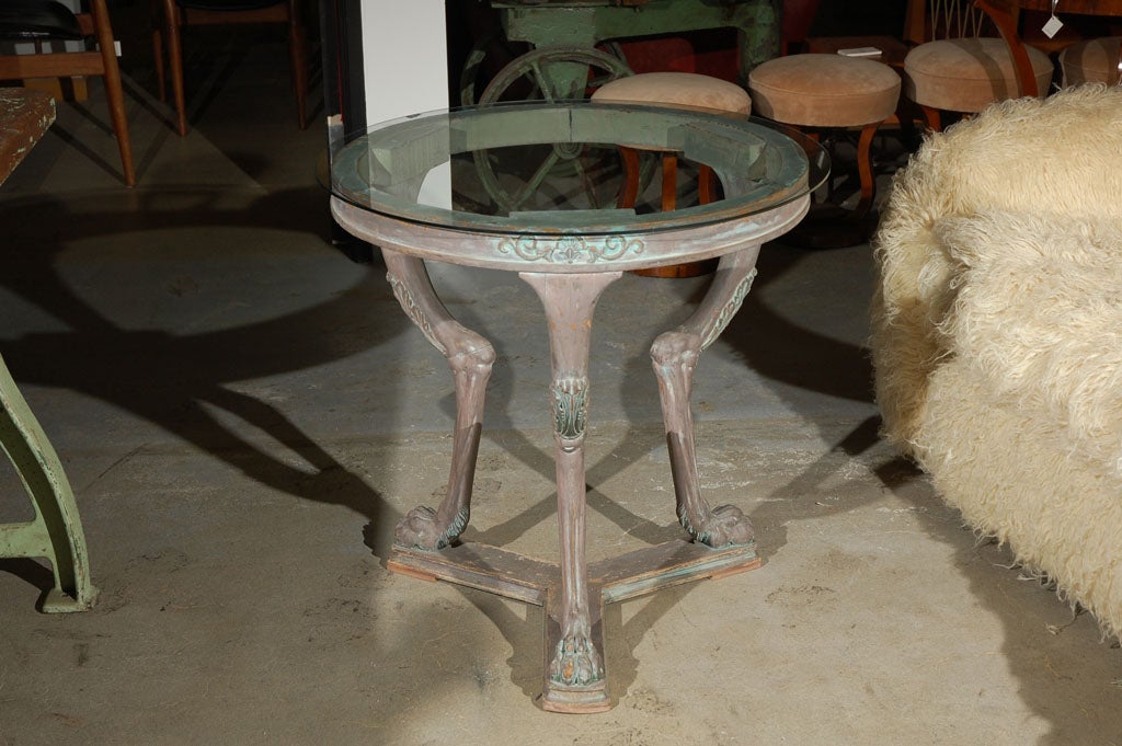 carved 3-legged clawfoot table w/glass top