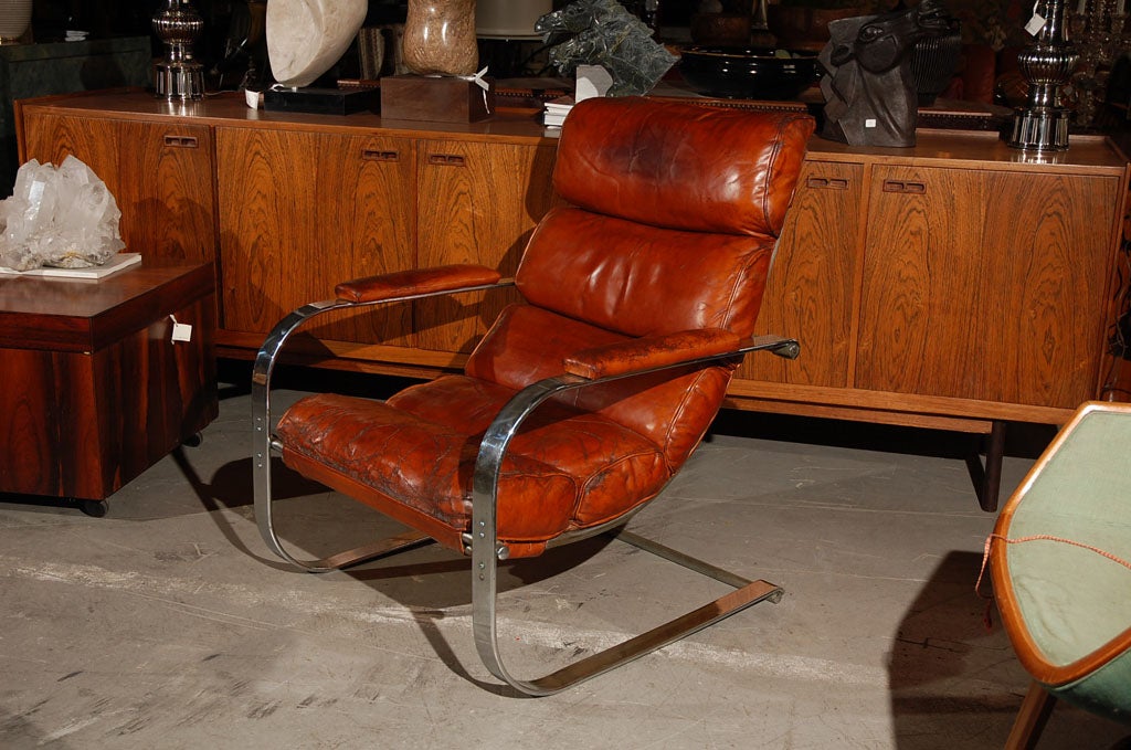 an upholstered chromed metal lounge chair, model # 180, manufactured by Troy Sunshade Company