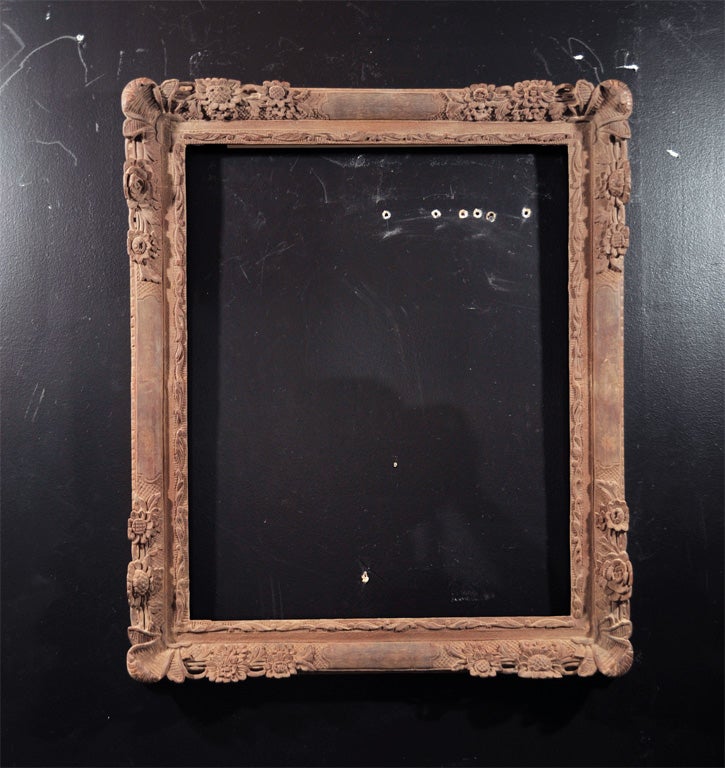 19th Century Reproduction of a Louis 13th style frame. Hand carved out of solid wood with ebonized finish. New backing was added sometime in 1970's.