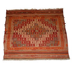 A Vintage Kilim Carpet with Geometric Motif and Striped Border