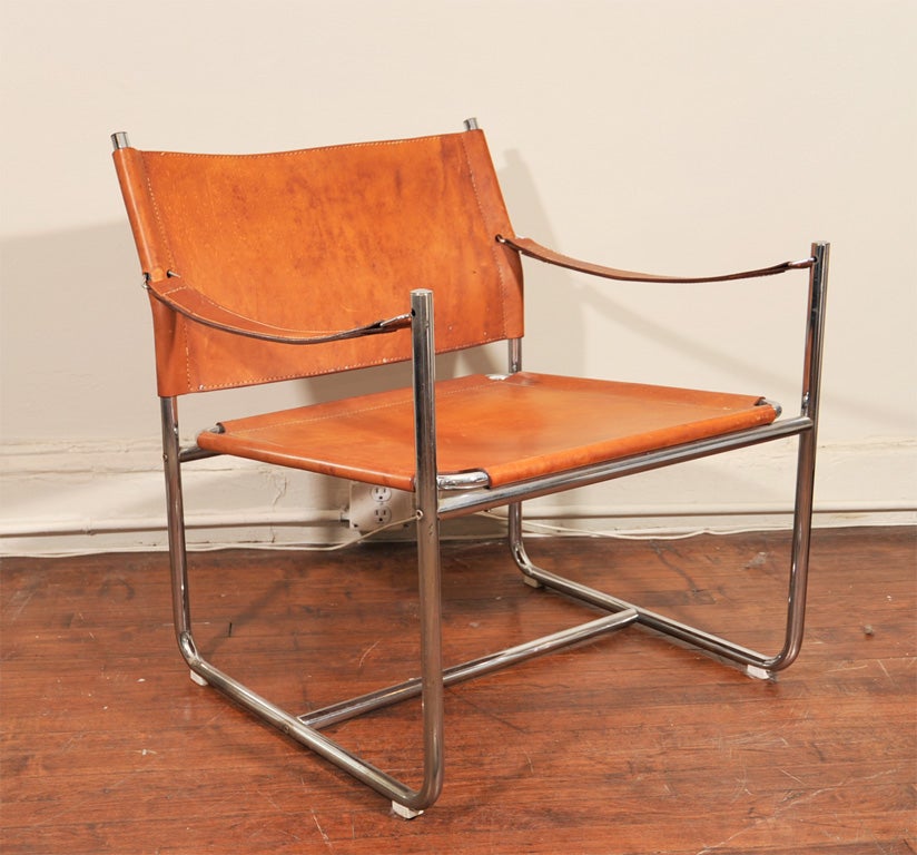 Simply a great pair of late 1960s leather and chrome sling chairs done in a natural calf leather.  This pair of chairs are in excellent condition with a minimal amount of wear on the leather.