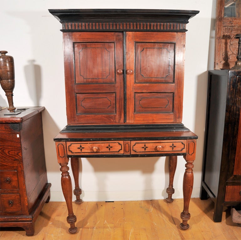 Beautiful colonial credenza desk with two drawers and cabinet hutch. Featuring Ebony details and piping and carved legs..