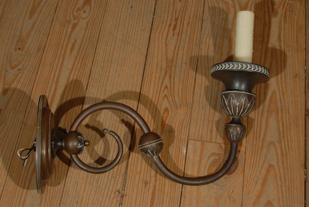 One of a kind Dutch antique bronze wall sconce. Newly wired with all UL listed parts and a single Edison socket. Pretty patina on the bronze. Only one sconce available. Choice of candle sleeve. Shown with ivory polybeeswax drip or with hand-colored